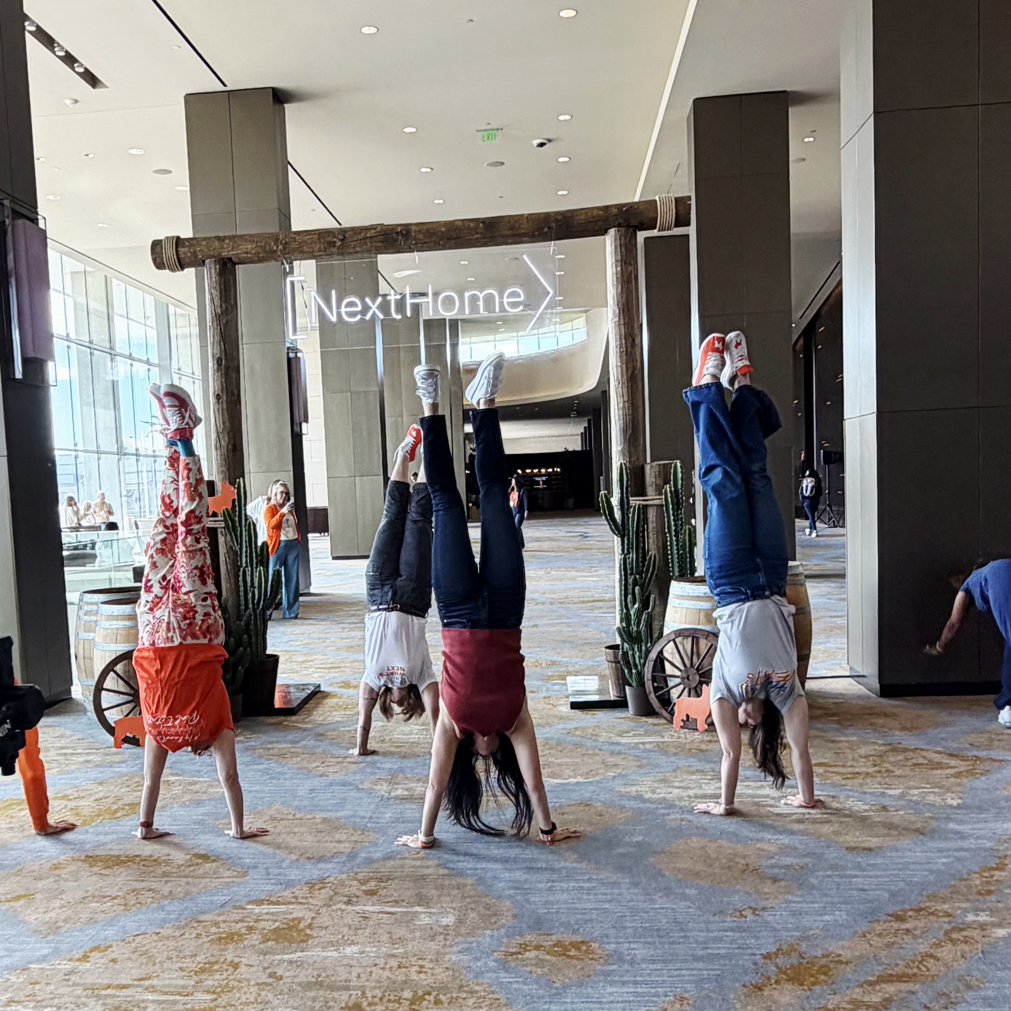 Janet doing a handstand at NextHome conference